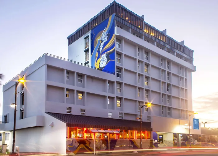 A vibrant pizza and cocktail in a trendy setting